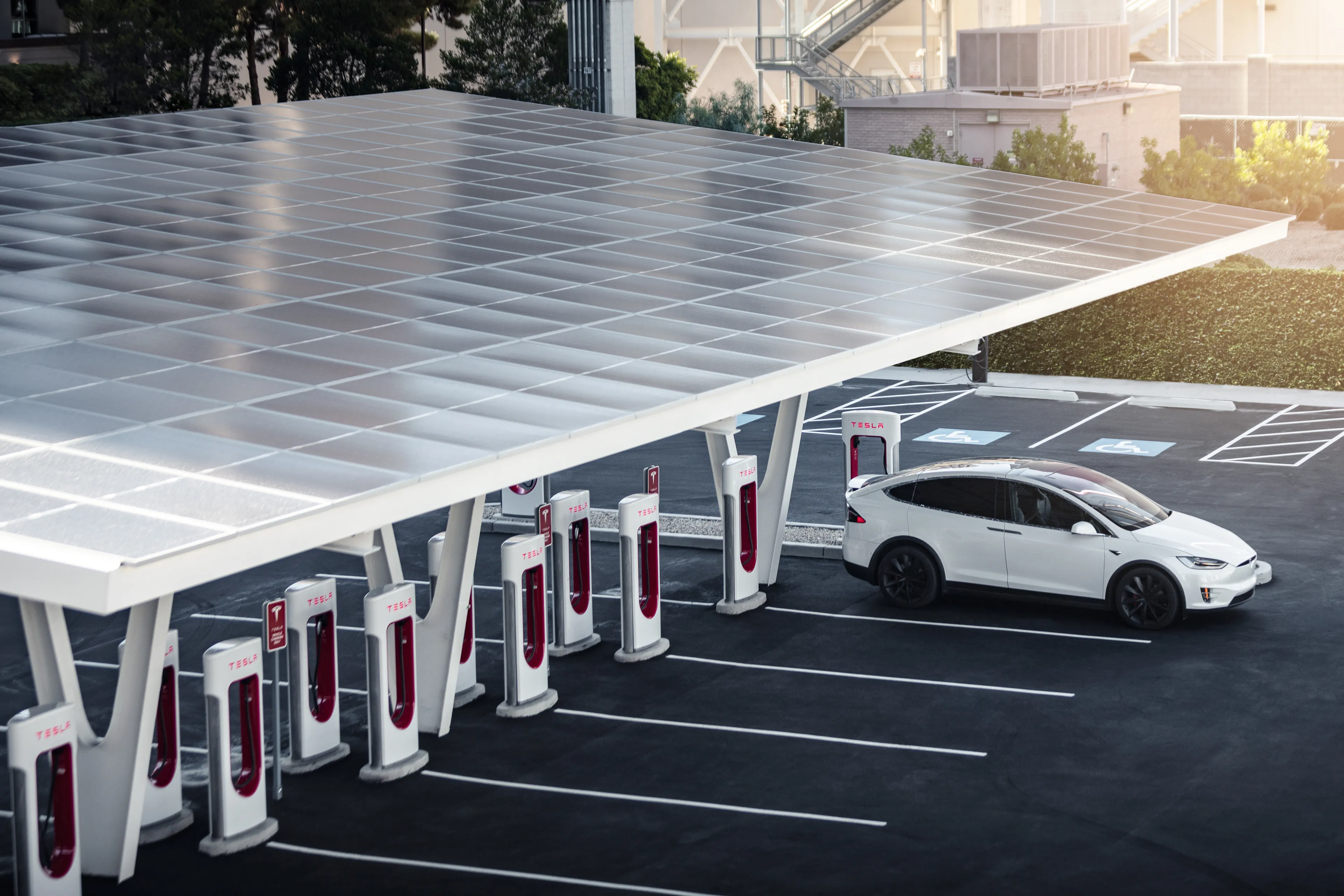 Solar-canopy Tesla Supercharger station with a Model X charging