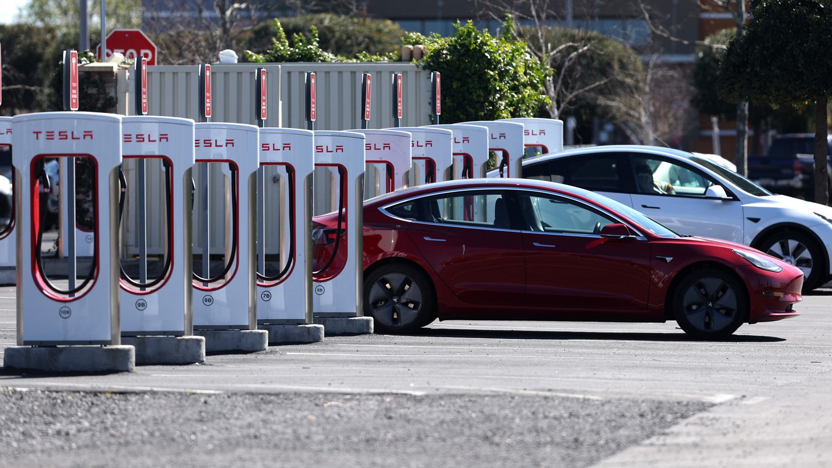 Tesla Supercharger station at dusk